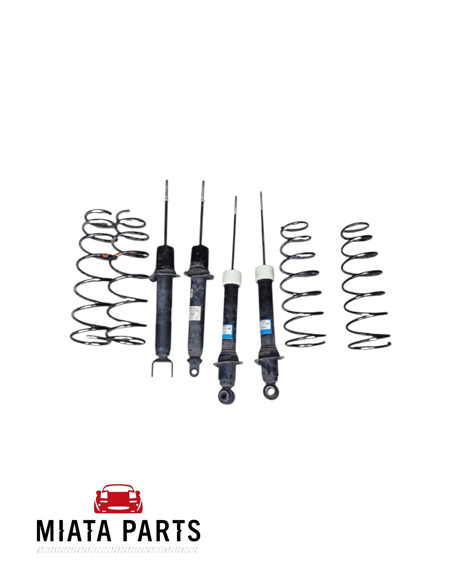 Miata Parts NZ used MX5 NC shock and spring set including four black coil springs and four shock absorbers.